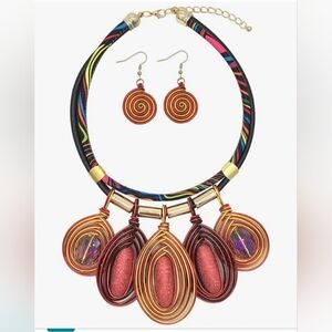 Bold Red and Gold Spiral Necklace with Ethnic Flair